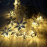 Новогодняя гирлянда нить Золотые резные снежинки 10 LED